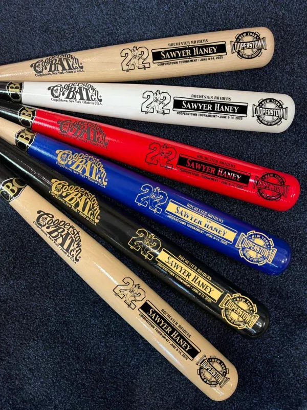 Colorful Cooperstown Bats on display, various designs.