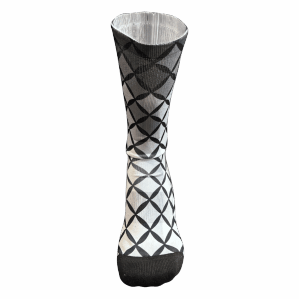 Geometric patterned sock with black and white design.